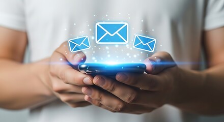 Hands holding smartphone with blue email icons communication