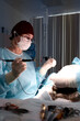 © Georgii - Surgeon performing a medical procedure in a sterile operating room setting