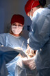 © Georgii - Professional surgeons focusing on a medical operation in a sterile environment