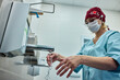 © Georgii - Medical professional washing hands in a clinical hygiene environment