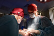© Georgii - Surgeons performing a medical operation in a professional hospital setting
