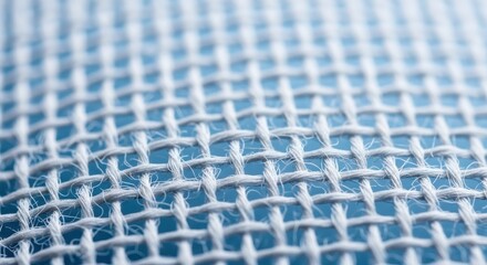 Macro View of White Fabric Weave Against Blue Background