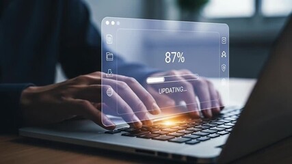 User Updating Software or Installing a Program on a Laptop Computer.