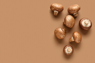 Wall Mural - Fresh raw mushrooms on brown background