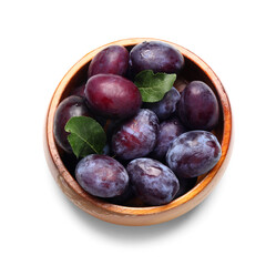 Wall Mural - wooden bowl with fresh ripe plums on white background