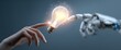 © Fargani - Human and robot hands touching a lightbulb