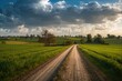© The 2R Artificiality - A rural path cuts through farmland beneath a stormy sky