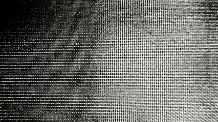 monochrome woven grid texture with dramatic light contrast and fine crosshatch pattern for modern wallpaper or editorial background