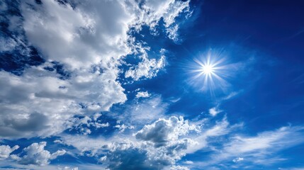 Wall Mural - Deep blue sky with puffy white clouds and a bright sun shining powerfully in the upper right corner, creating a sense of freedom and openness