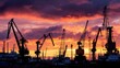 © Sawat - Sunset over industrial harbor with cranes silhouetted against vibrant sky at dusk reflecting on water surface