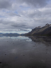 Wall Mural - Beautiful mountain view with cloudy sky at the lake.
