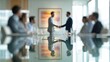 © Anna - Business partnership agreement in modern office setting with diverse team