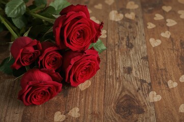 Wall Mural - Lovely crimson roses on a romantic holiday backdrop, floral pattern, texture, design, warm season, marriage celebration, heart shape, natural elements, classic, timber