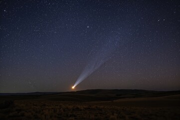 Wall Mural - Radiant comet streaking across the nocturnal sky, scenic nighttime panorama.