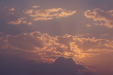 Wall Mural - Sunset glow illuminating the soft lilac and blue horizon. A natural sky design for photo backgrounds. Peaceful twilight with gentle clouds and radiant hues.