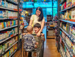 © Apichat - woman and two children are shopping in a grocery store