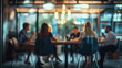 © Cascade Image Studio - Business office meeting behind glass pains with people sitting at a table with blurred people casual wear, with blurred bokeh background