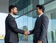 © KALOKI - Poignée de main professionnelle et inclusive en entreprise – diversité, partenariat et confiance