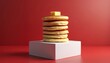 © miss irine - Tall stack fluffy pancakes topped butter. Minimalist style red background. Golden brown color. Fresh homemade breakfast, brunch, dessert, sweet food, indulgent treat. Tasty, delicious, enjoyable