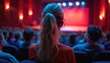 © miss irine - Audience watches stage performance. People sit in theater hall waiting for event, show to begin. Spectators enjoy concert or play. Woman watches theatrical act.
