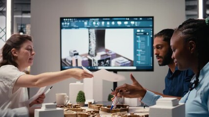 Real estate experts team presenting a master plan for residential project, creating a construction layout based on zoning regulations with 3D models. City planning for development. Camera A.