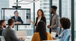 © Eduardo Accorinti - Hispanic businesswoman giving presentation to diverse business team during video conference with male senior asian manager or CEO in modern office