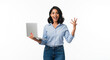 © Neha - Young indian excited woman holding laptop on white background