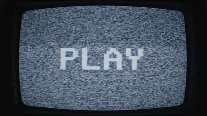 Static TV Screen with PLAY Text - A close-up shot of an old television screen displaying the word 