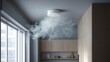 © Alohanongza - Smoke fills a modern kitchen as a ceiling smoke detector activates, highlighting a potential fire safety hazard in the home