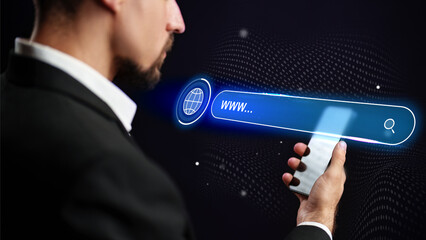 Man using smartphone to search on the internet with a digital interface at night