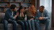 © Yuliia - Four multiracial people home party frustrated woman friends supporting calming on couch together upset girl holding head talking problem breakup diverse men women buddies consoling psychological help