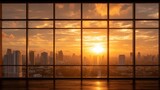 Urban cityscape with sky view from large window at sunset. Empty room with big glass wall overlooking metropolis at sunrise. Modern apartment background.