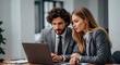 © Karmiyem - Business partners reviewing data on laptop serious teamwork collaboration corporate office success strategy planning professionals meeting