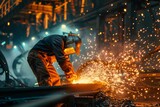 Industrial worker cutting metal and producing sparks in a steel mill