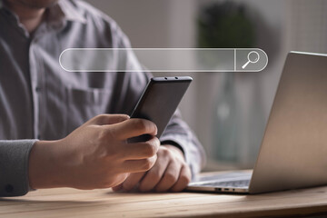 Wall Mural - Businessman using smartphone with virtual search bar interface, concept of online search, SEO, digital marketing, internet research, web browsing, modern technology, and information access.