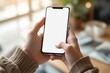 © PlanetOfVectors - Close-up of hands holding smartphone with blank white screen, realistic photographic style, blurred indoor background, concept of digital communication, Ai generative