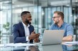 © PlanetOfVectors - Two cheerful businessmen discussing ideas at a desk with a laptop in a modern office, creative collaboration concept, bright glass background. Ai generative