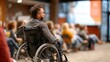 © Naree - A man in a wheelchair listens attentively to a presentation in a conference setting, showcasing inclusivity and engagement in the audience.