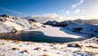 © erna - Snowy mountain lake landscape panorama under a bright, slightly cloudy sky view