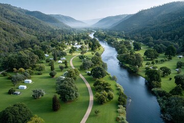 Wall Mural - Scenic aerial view of lush green valley with river and campsites