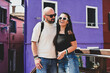 © Striker777 - Happy smiling beautiful  Tourists  couple traveling at   Venice Italy, poses and making photos   at Buraano Island against colorful houses.  .Concept of Italian gastronomy and travel. Italian couple