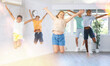 © JackF - Positive children jumping while studying modern style dance in class indoors