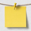 © Queen - Empty yellow sticky note pinned to a wall