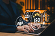© Sandwish - ISO Certification and quality management concept. Businesswoman using laptop with ISO certified and quality assurance icon, international standards, compliance, quality management systems, certificate