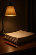 © Freelance - A quiet study or office desk at night with a classic lamp illuminating a stack of papers and a pen