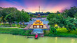 © huythoai - Aerial view of Phu Van Lau Pavilion (Pavilion of Edicts) in front of the Flag Tower of the Citadel in Hue, Vietnam. The flag of Vietnam fluttering over the Citadel.
