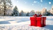 © Enak - Red gift box in snowy winter landscape