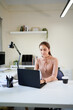 © Stella 16 - Woman working on computer at home office desk using desktop pc for remote work job