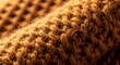 © Ramli - Close-up of cozy brown knitted wool fabric texture background