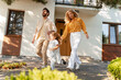 © Maria Vitkovska - Happy family, mother and father running out of house holding hands